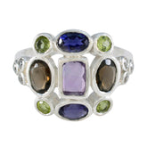 Meera navratna cocktail ring with multicolored gemstones set in silver band