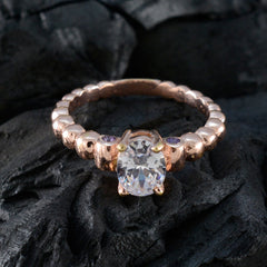 Rose gold beaded band with central clear stone and two small purple side gems purple gemstone fashion ring