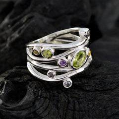 Natcha sterling silver multi band ring with peridot center and purple accent stones purple gemstone statement ring