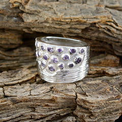 Milagros purple gemstone statement ring with multiple purple stones set in textured silver band
