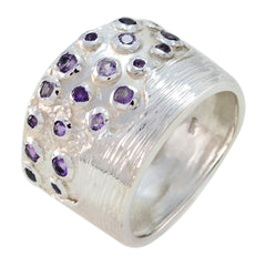 Milagros wide silver ring featuring multiple small purple gemstones purple gemstone statement ring