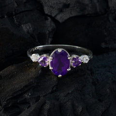 Julia purple gemstone trilogy ring with oval amethyst center, two pear side stones, sterling silver band