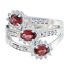 Chloe purple trilogy ring with three red oval gemstones, halo diamonds and split shank pave detailing