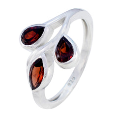 Putri silver ring featuring three deep red gemstones in a unique red gemstone trilogy ring design