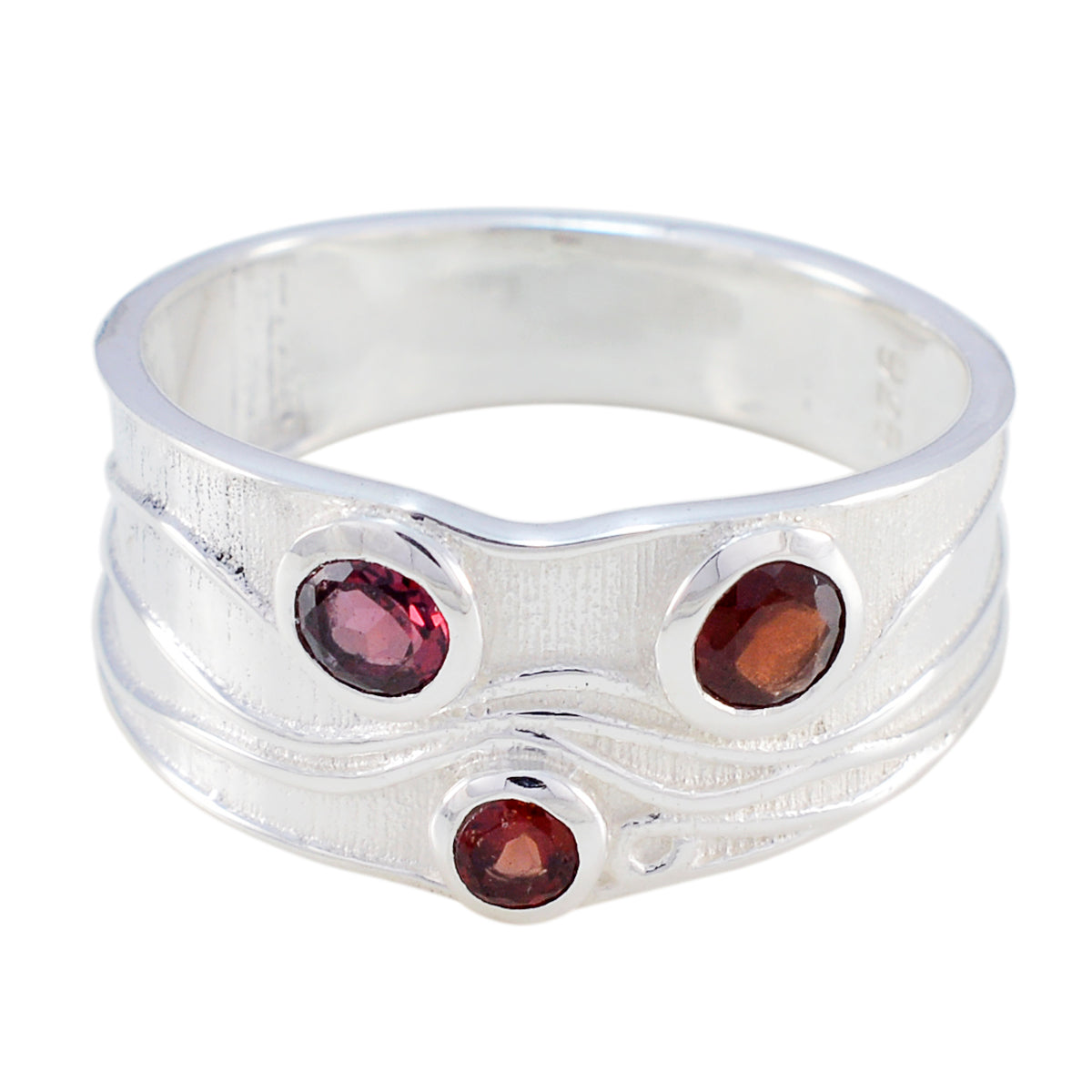 Penelope silver band red gemstone trilogy ring with three red oval gemstones set in unique design