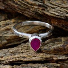 Ying red solitaire ring for women with a pear-shaped red gemstone set in a silver band