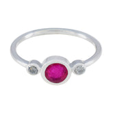 Kristine silver red trilogy gemstone ring with a central red stone and two small clear stones