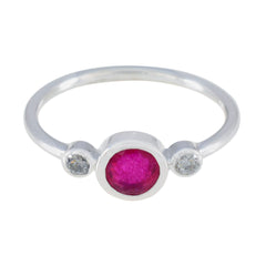 Kristine silver red trilogy gemstone ring with a central red stone and two small clear stones