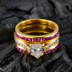 Isadora gold band trendy red gemstone ring with heart shaped clear center stone and pave accents