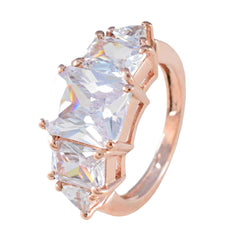 Rina rose gold band with three large clear stones for a trendy white gemstone ring with sparkling facets
