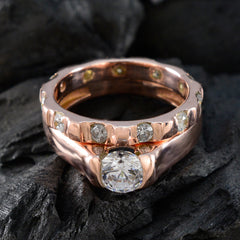 Araya trendy white gemstone ring with large centerpiece and multiple smaller stones on rose gold band