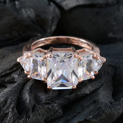 Rina rose gold ring with large emerald cut center stone and two triangular side stones trendy white gemstone ring
