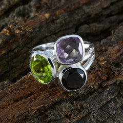 Daniela silver trilogy ring for women with amethyst peridot and black gemstone in bezel settings on bark