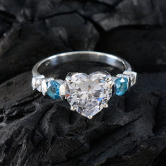 Nova white gemstone heart ring in sterling silver with heart cut center stone and blue side gemstones