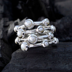 Ivy white gemstone stacked rings featuring multiple pearls set in polished silver bands