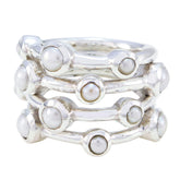 Ivy white gemstone stacked rings with silver bands featuring round white gemstones