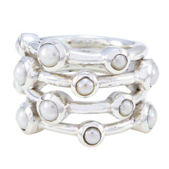 Ivy white gemstone stacked rings with silver bands featuring round white gemstones