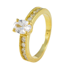 Seo yeon gold ring with oval white center stone and pave side stones white stone glamorous ring for weddings