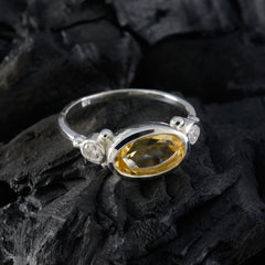 Hana yellow gemstone trilogy ring in sterling silver with oval yellow stone and two clear side accents