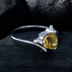 Riya yellow solitaire ring with a triangle-cut yellow gemstone set in a silver band