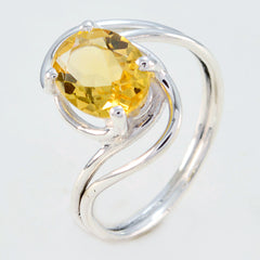 Saanvi yellow solitaire ring with oval yellow gemstone set in a twisted silver band