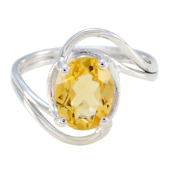 Saanvi yellow solitaire ring with oval yellow gemstone set in a silver twisted band