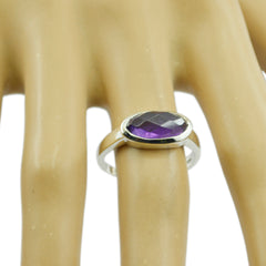 Lakshmi abstract purple solitaire ring with oval faceted gemstone set on silver band