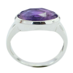 Lakshmi abstract purple solitaire ring with a faceted purple gemstone set in silver band