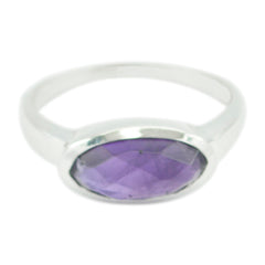 Lakshmi abstract purple solitaire ring with oval faceted purple stone set in silver band