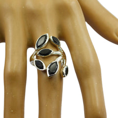 Lakshmi black gemstone ring with multiple marquise-cut black stones set in silver on a hand