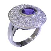 Lakshmi purple halo ring featuring a central purple gemstone surrounded by sparkling clear stones