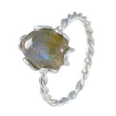 Lakshmi solitaire grey ring with twisted silver band and polished grey gemstone centerpiece