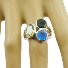 Lakshmi trilogy gemstone ring with green, black, and blue stones set in silver band
