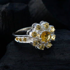 Lakshmi yellow gemstone ring featuring a central yellow stone surrounded by smaller yellow gemstones in silver setting