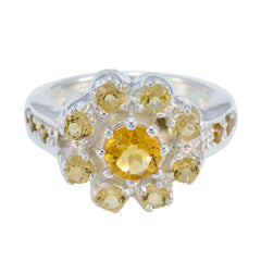 Lakshmi yellow gemstone ring with a large central stone surrounded by smaller yellow gemstones in silver setting