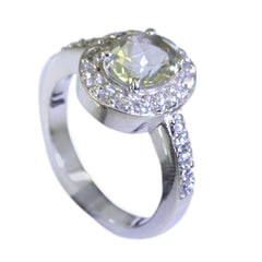 Chen light green halo ring with round prong set center stone and pave diamond band in white gold