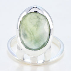 Yasmine light green solitaire ring with oval gemstone set in polished silver band