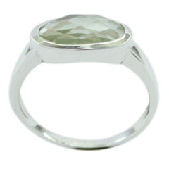 Rina light green solitaire ring with faceted oval gemstone set in silver band