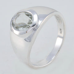 Carla light green solitaire ring with a polished silver band and oval gemstone