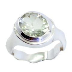 Camila light green solitaire ring with a faceted oval gemstone set in polished silver band