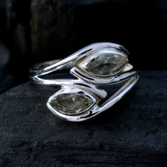 Liyana silver light green toi et moi ring featuring two marquise pale green gemstones in a twisted band