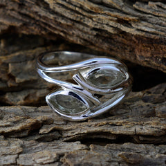 Liyana light green toi et moi ring sterling silver band with two marquise light green stones on rustic wood