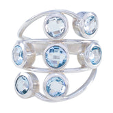 Luxurious blue gemstone ring by Camila featuring multiple round blue stones set in silver band