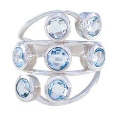 Luxurious blue gemstone ring by Camila featuring multiple round blue stones set in silver band