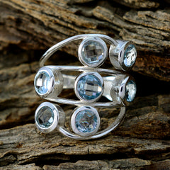 Camila luxurious blue gemstone ring with multiple faceted blue stones set in silver bands