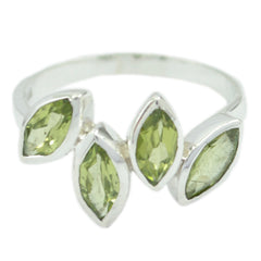 Natcha luxurious green gemstone ring with four marquise peridot stones set in sterling silver open band