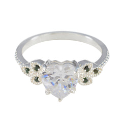Penelope silver ring with heart shaped clear center stone and small green accents luxurious green gemstone ring
