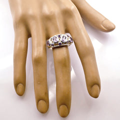 Riya luxurious purple gemstone ring displayed on a mannequin hand with metal band and purple stones