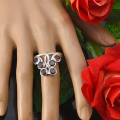 Angel luxurious red gemstone ring featuring multiple red stones set in elegant silver band on hand