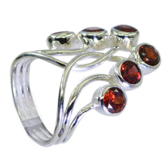 Angel luxurious red gemstone ring with intricate silver band featuring multiple round red stones